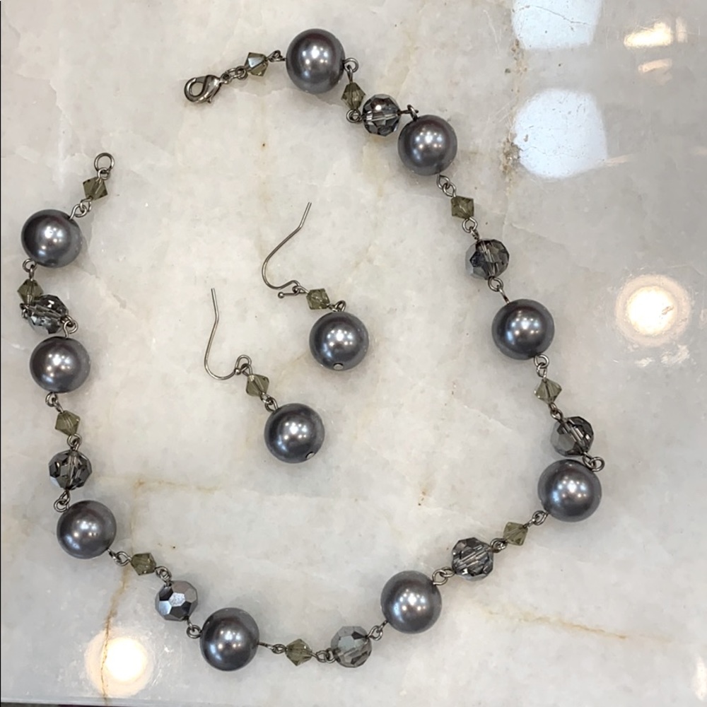 Necklace and earring duo on a silver chain